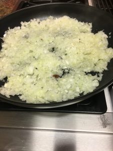 Gently saute onions in melted butter